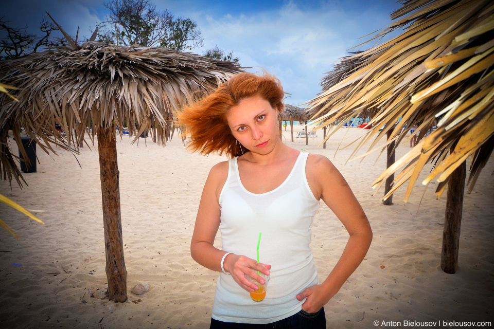 Viki drinks cocktail on the beach at Club Amigo Atlantico Guardalavaca hotel