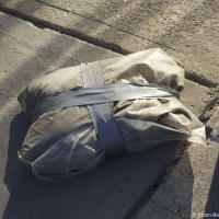 Packege of dust on Toronto street sidewalk in the morning Packege of dust on Toronto street sidewalk in the morning