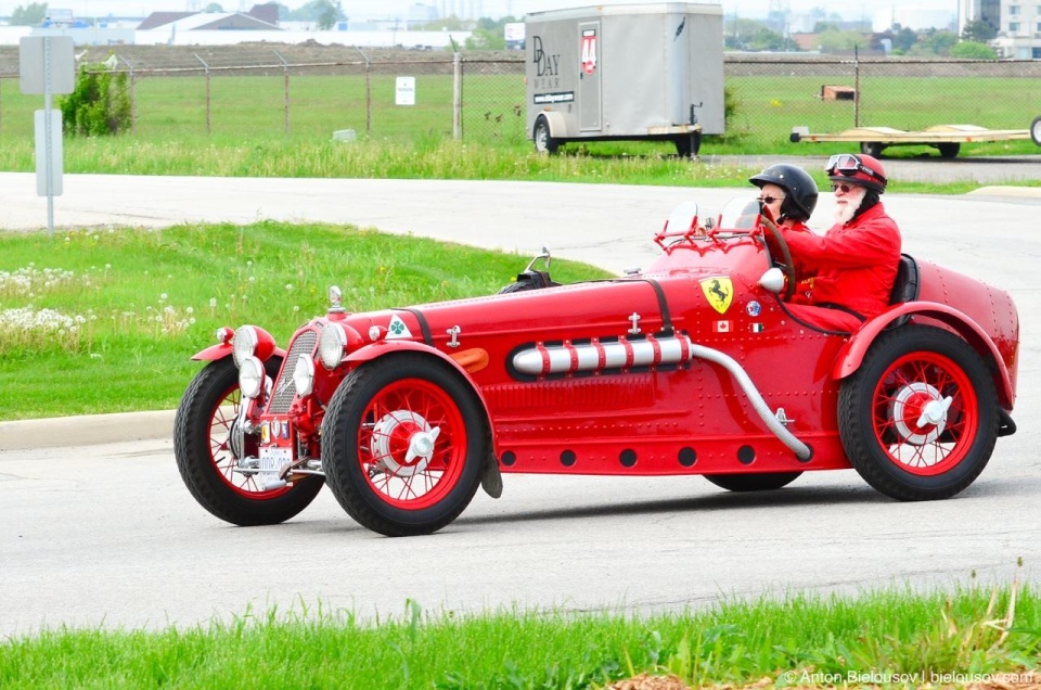 Santa Claus driving old Fiat (Ferrari)