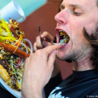 Yuriy Dybskiy participating in burger eating challenge at Riverbed Bistro in Keremos, BC Yuriy Dybskiy participating in burger eating challenge at Riverbed Bistro in Keremos, BC