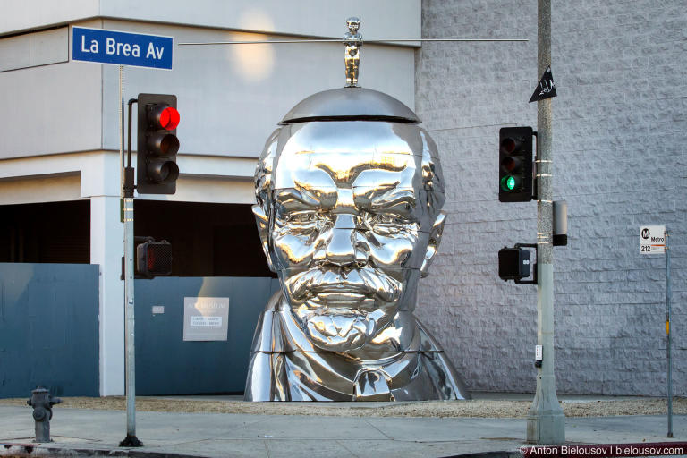 Miss Mao Trying to Poise Herself at the Top of Lenin’s Head (The Gao Brothers) Los Angeles, CA